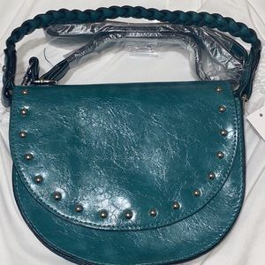 Brand new small adjustable strap purse!